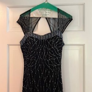 Beautiful formal gown. Worn twice. Two spots where beading pulled  see picture.